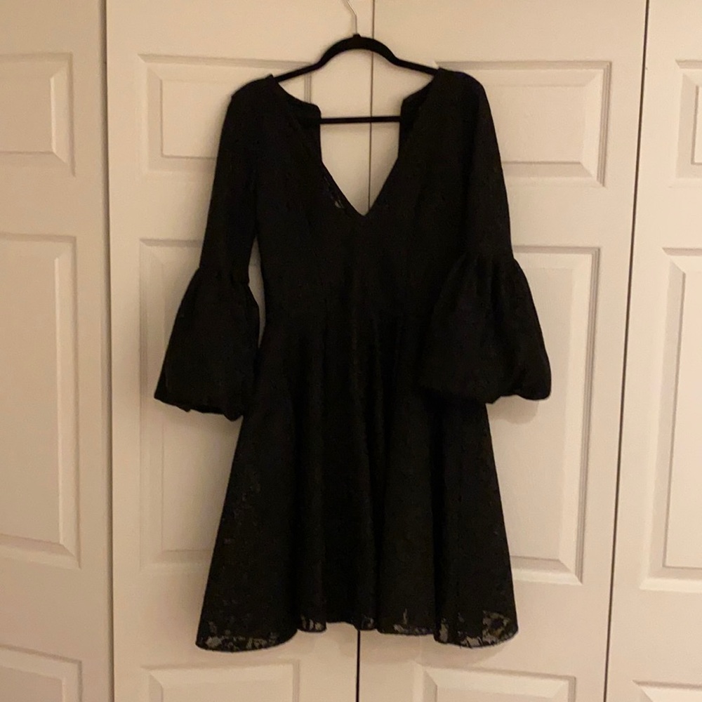 Beautiful black dress with big sleeves.